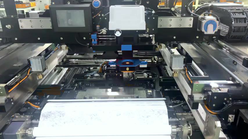 Print stage with the board clamped under the stencil